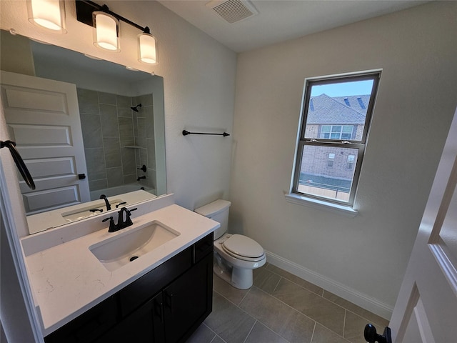 full bathroom with toilet, baseboards, visible vents, vanity, and shower / tub combination