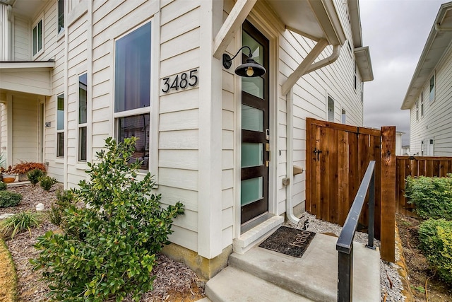 property entrance featuring fence