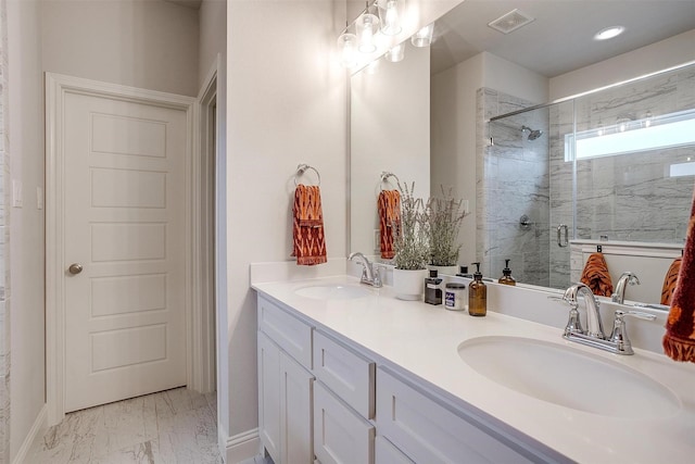 full bath featuring a shower stall, marble finish floor, a sink, and visible vents