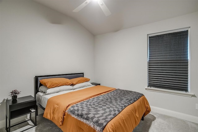 carpeted bedroom with lofted ceiling, baseboards, and ceiling fan