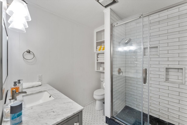 230 W Sesame St, Karnack, TX 75661 - bathroom with toilet, vanity, a stall shower, and a textured ceiling