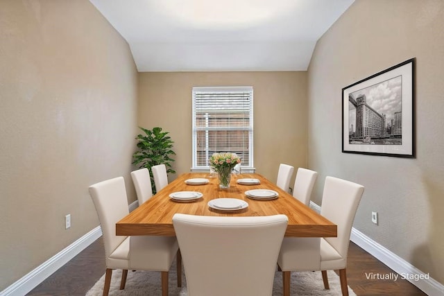 1209 Roadrunner Dr, Little Elm, TX 75068 - dining area with baseboards, dark wood-style flooring, and vaulted ceiling