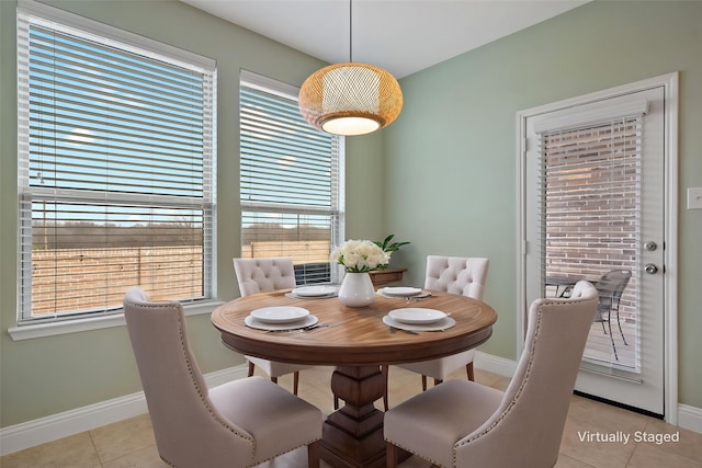 1209 Roadrunner Dr, Little Elm, TX 75068 - dining space featuring light tile patterned flooring, baseboards, and healthy amount of natural light