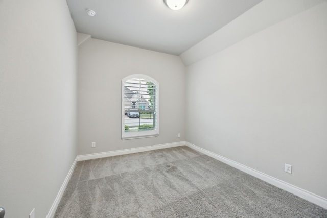 8517 Holliday Creek Way, Mckinney, TX 75071 - empty room with carpet flooring, baseboards, a smoke detector, and lofted ceiling