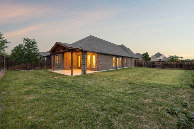 8517 Holliday Creek Way, Mckinney, TX 75071 - back of house with brick siding, a patio, and a shingled roof