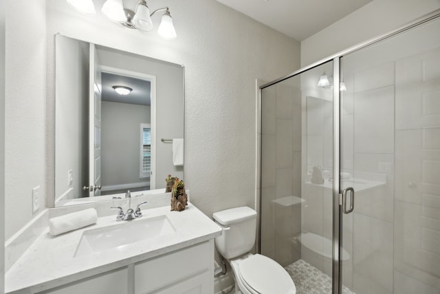 8517 Holliday Creek Way, Mckinney, TX 75071 - bathroom with a textured wall, toilet, a shower stall, and vanity