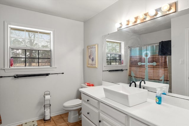 bathroom featuring vanity, baseboards, toilet, tile patterned flooring, and a shower with shower curtain