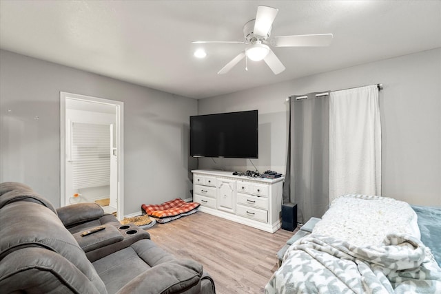 bedroom featuring a ceiling fan, baseboards, and light wood-style floors