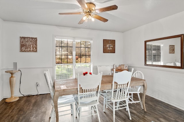 dining space with wood finished floors, baseboards, and ceiling fan