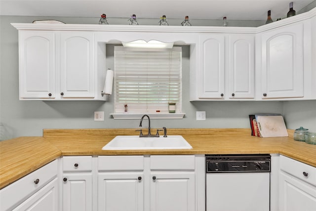 103 Elm St, Roxton, TX 75477 - kitchen with light countertops, dishwasher, white cabinetry, and a sink