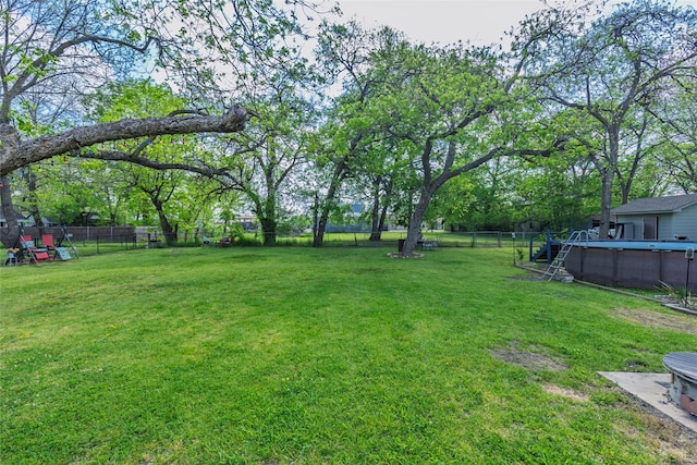 103 Elm St, Roxton, TX 75477 - view of yard with a fenced backyard and a fenced in pool