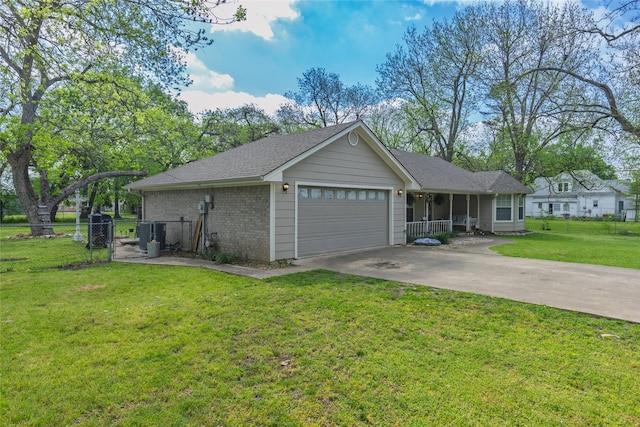 103 Elm St, Roxton, TX 75477 - view of front facade featuring a front lawn, a gate, concrete driveway, fence, and an attached garage