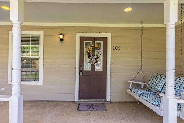 103 Elm St, Roxton, TX 75477 - doorway to property featuring a porch