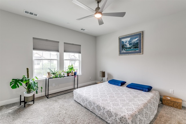 bedroom featuring visible vents, carpet flooring, and baseboards