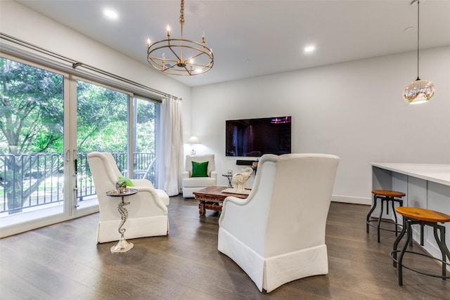 living room featuring a chandelier, dark wood-style flooring, and recessed lighting