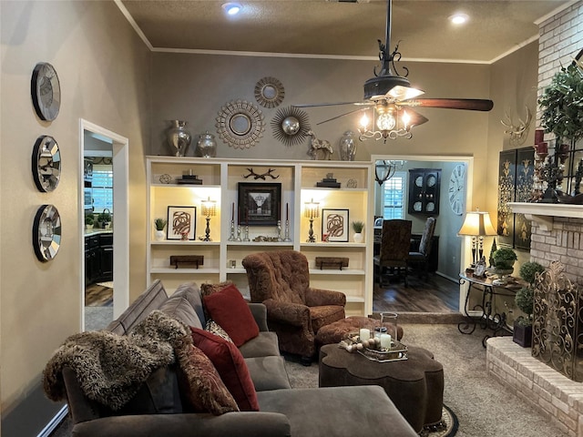 1302 Summit Dr, Mexia, TX 76667 - living area with baseboards, a ceiling fan, wood finished floors, a brick fireplace, and ornamental molding