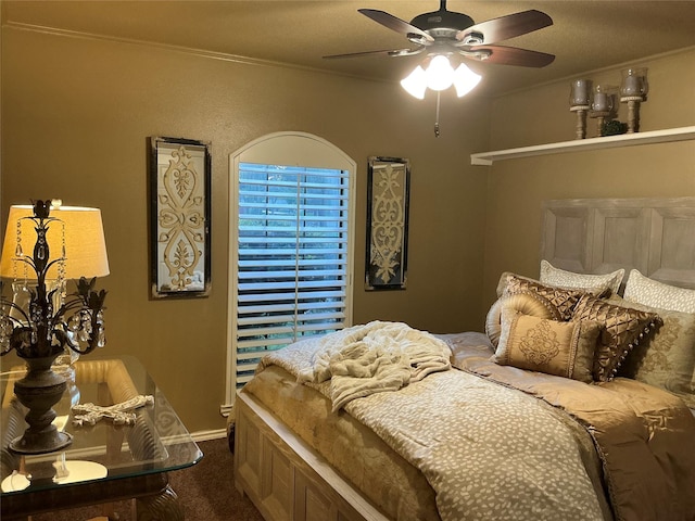 1302 Summit Dr, Mexia, TX 76667 - carpeted bedroom with ceiling fan, baseboards, and ornamental molding