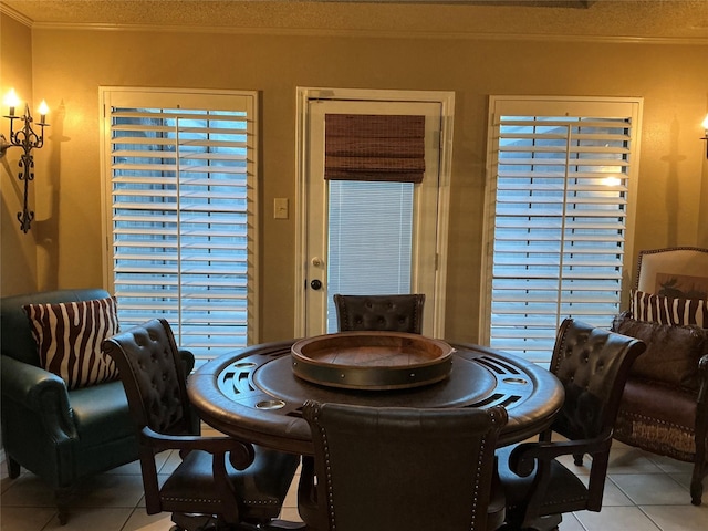 1302 Summit Dr, Mexia, TX 76667 - dining room with light tile patterned floors and crown molding