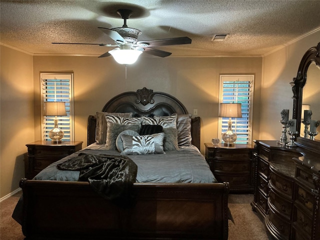 1302 Summit Dr, Mexia, TX 76667 - bedroom featuring carpet, visible vents, a ceiling fan, crown molding, and a textured ceiling