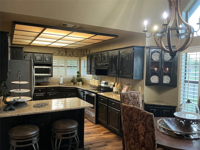 1302 Summit Dr, Mexia, TX 76667 - kitchen featuring visible vents, a wealth of natural light, stainless steel appliances, and a sink