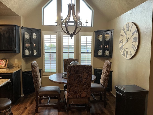 1302 Summit Dr, Mexia, TX 76667 - dining room featuring dark wood finished floors, a textured ceiling, high vaulted ceiling, and an inviting chandelier