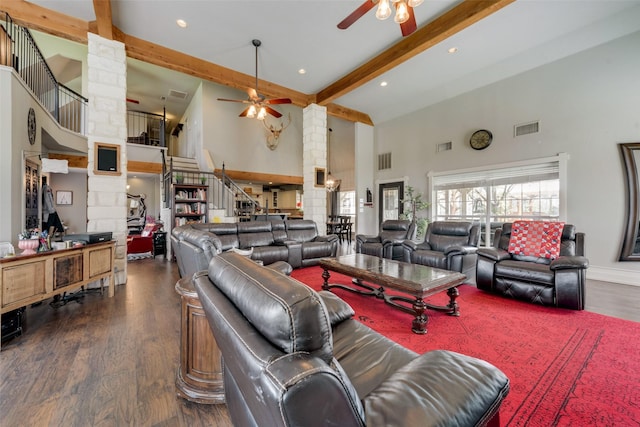 3408 Fm 2280, Cleburne, TX 76031 - living area with decorative columns, ceiling fan, a towering ceiling, beamed ceiling, and stairs