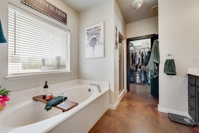 3408 Fm 2280, Cleburne, TX 76031 - full bathroom featuring concrete flooring, vanity, a bath, a stall shower, and a spacious closet