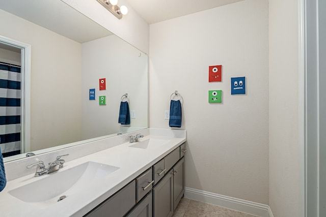 4409 Switchgrass St, Celina, TX 75009 - full bathroom with tile patterned flooring, baseboards, a sink, and double vanity