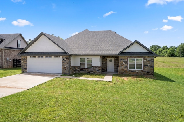 craftsman-style home featuring concrete driveway, a front lawn, stone siding, and a garage