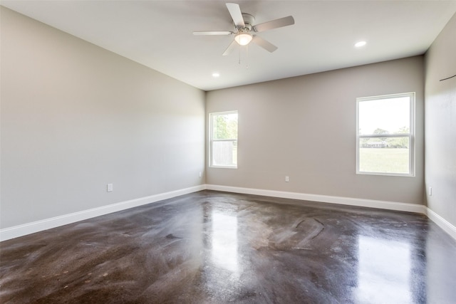 empty room featuring baseboards, a ceiling fan, concrete flooring, and recessed lighting