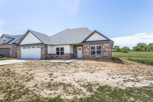 craftsman house with a garage, concrete driveway, roof with shingles, and stone siding