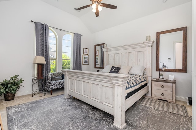 bedroom with a ceiling fan, baseboards, and lofted ceiling