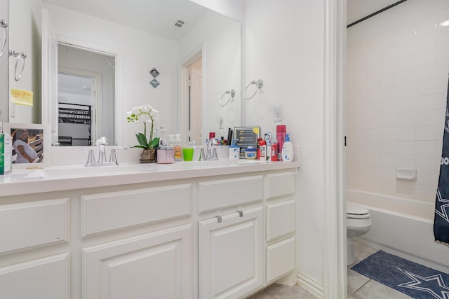 bathroom with a sink, tile patterned flooring, shower / bath combo, double vanity, and toilet