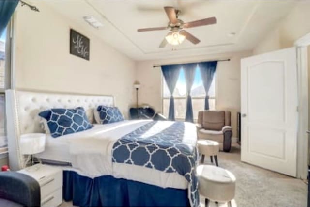 bedroom with light colored carpet and ceiling fan