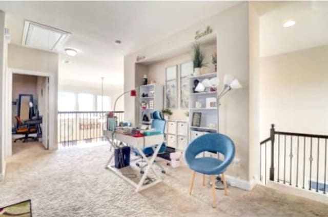 carpeted office with attic access