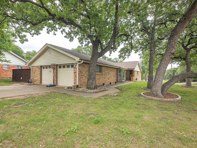 81 Regents Park, Bedford, TX 76022 - single story home featuring brick siding, driveway, an attached garage, and a front lawn