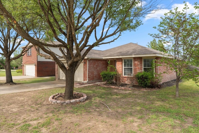 view of front facade featuring brick siding, an attached garage, a front yard, and concrete driveway
