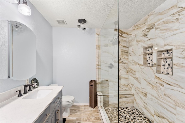 full bath featuring walk in shower, visible vents, a textured ceiling, and toilet