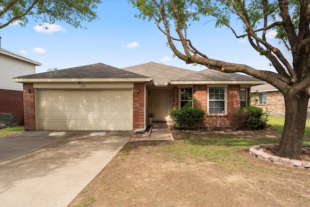 1142 Singletree Dr, Forney, TX 75126 - ranch-style house with brick siding, a garage, driveway, and roof with shingles