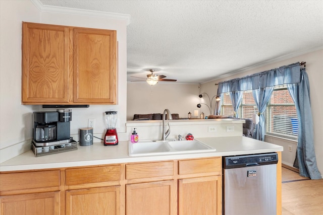 kitchen with dishwasher, a sink, a peninsula, a textured ceiling, and ceiling fan