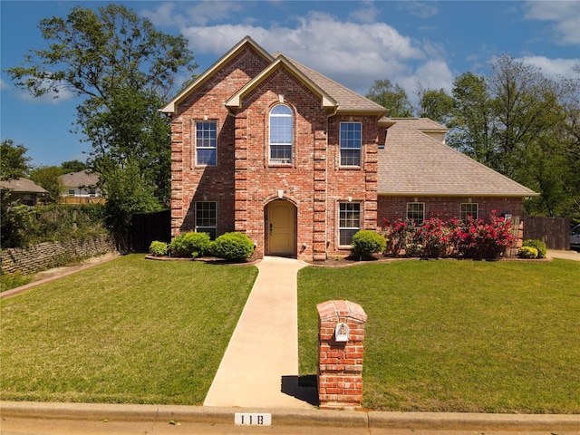 118 Chickadee Dr, Whitehouse, TX 75791 - traditional-style home featuring a front lawn, brick siding, fence, and a shingled roof