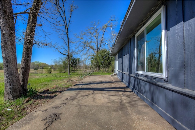 view of side of home featuring a patio