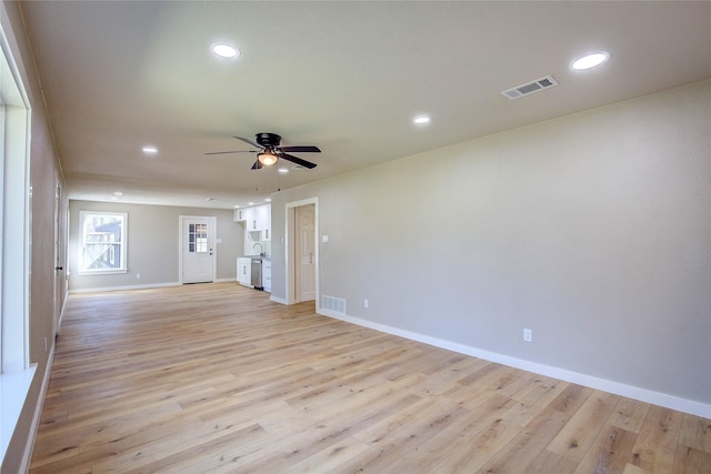 empty room with recessed lighting, light wood-type flooring, visible vents, and ceiling fan