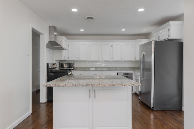 7024 Irongate Ln, Dallas, TX 75214 - kitchen with appliances with stainless steel finishes, wall chimney range hood, white cabinets, dark wood-style floors, and light stone counters