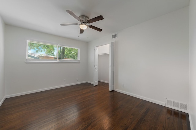 7024 Irongate Ln, Dallas, TX 75214 - unfurnished bedroom with dark wood finished floors, a ceiling fan, and a closet