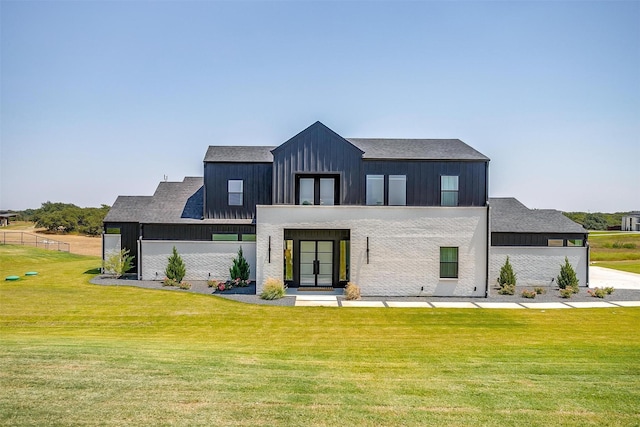 148 Kristina Blvd, Decatur, TX 76234 - rear view of house featuring a lawn, a shingled roof, board and batten siding, and french doors