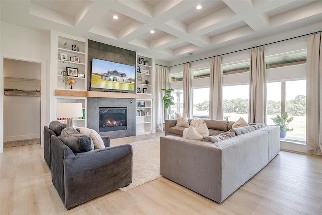 living room with light wood-style flooring, beam ceiling, recessed lighting, coffered ceiling, and a fireplace