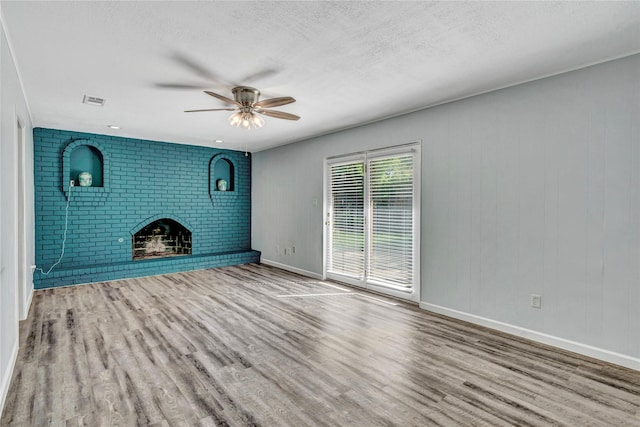 4225 Dawn Dr, Benbrook, TX 76116 - unfurnished living room featuring visible vents, a ceiling fan, wood finished floors, and a textured ceiling
