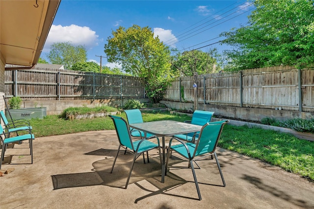 4225 Dawn Dr, Benbrook, TX 76116 - view of patio featuring outdoor dining space and a fenced backyard