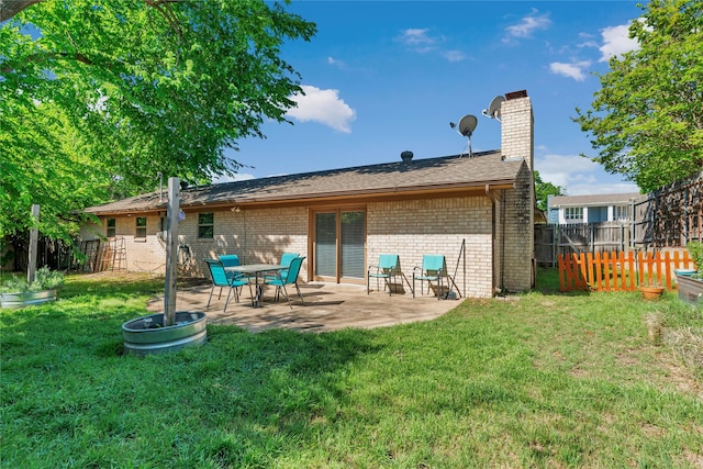 4225 Dawn Dr, Benbrook, TX 76116 - rear view of property with a lawn, a chimney, fence, a patio, and brick siding